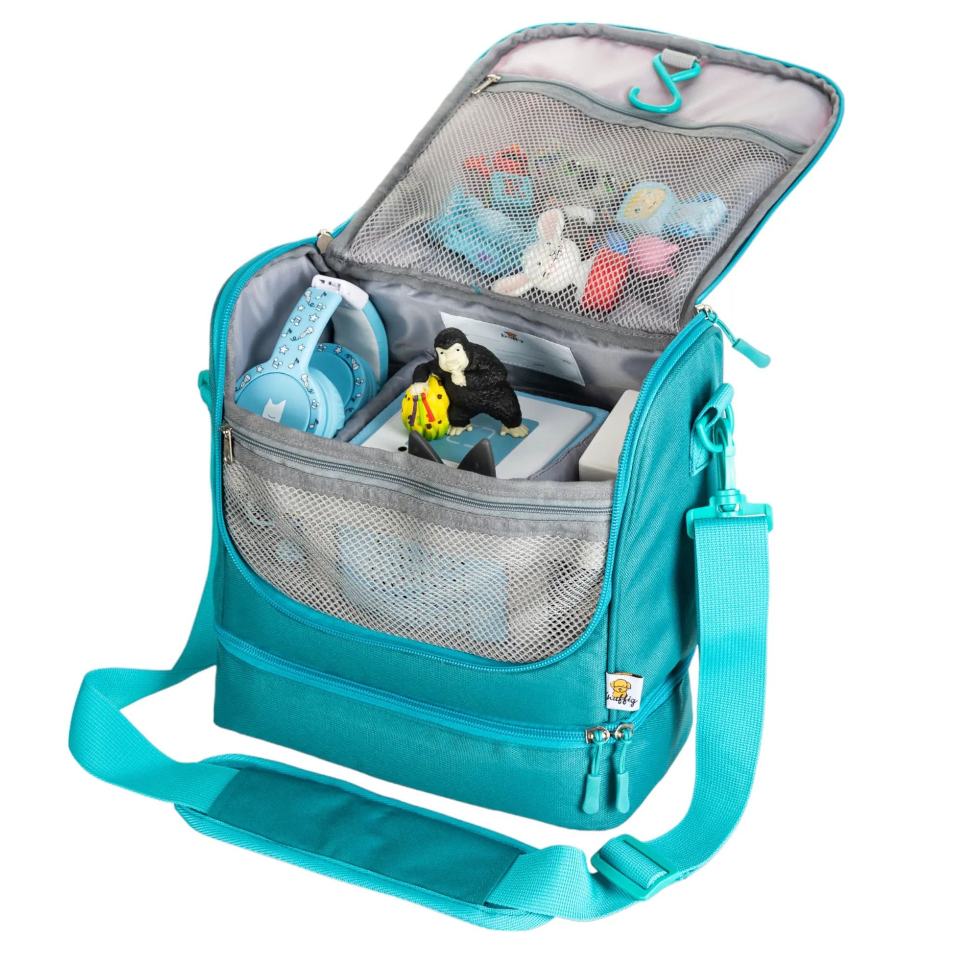 Die geöffnete rosa Einhorn-Tasche an der Wand aufgehängt, sodass sie als übersichtlicher Wand-Organizer für Stifte und Kleinteile genutzt werden kann.
