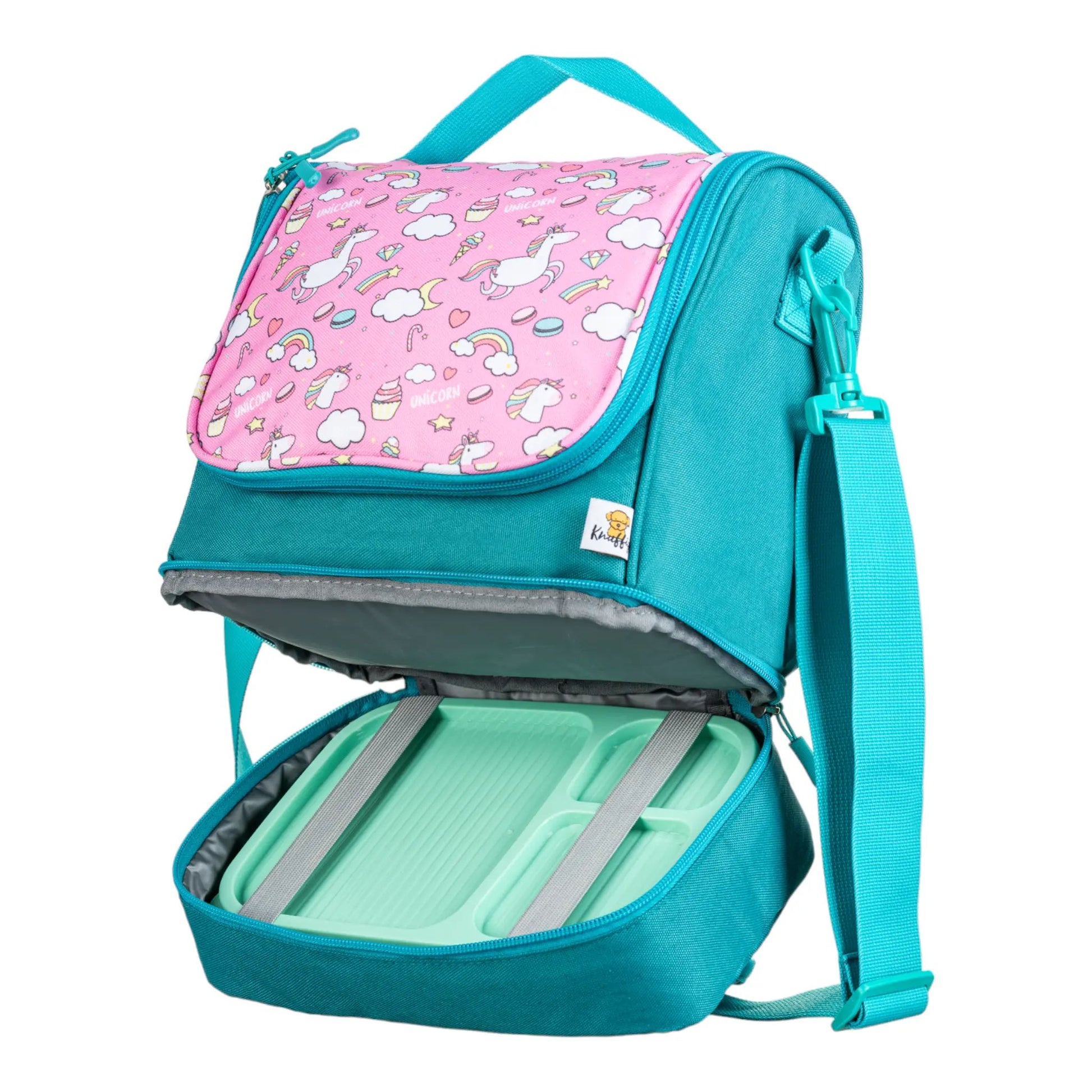 Rosa Einhorn-Umhängetasche, an der eine passende Lunchbox mit einem praktischen Gummiband sicher befestigt ist.
