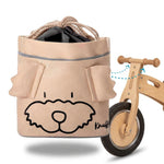 Beige Knuffig Lenkertasche für Kinderlaufrad mit Hundedesign, befestigt am Holz-Laufrad